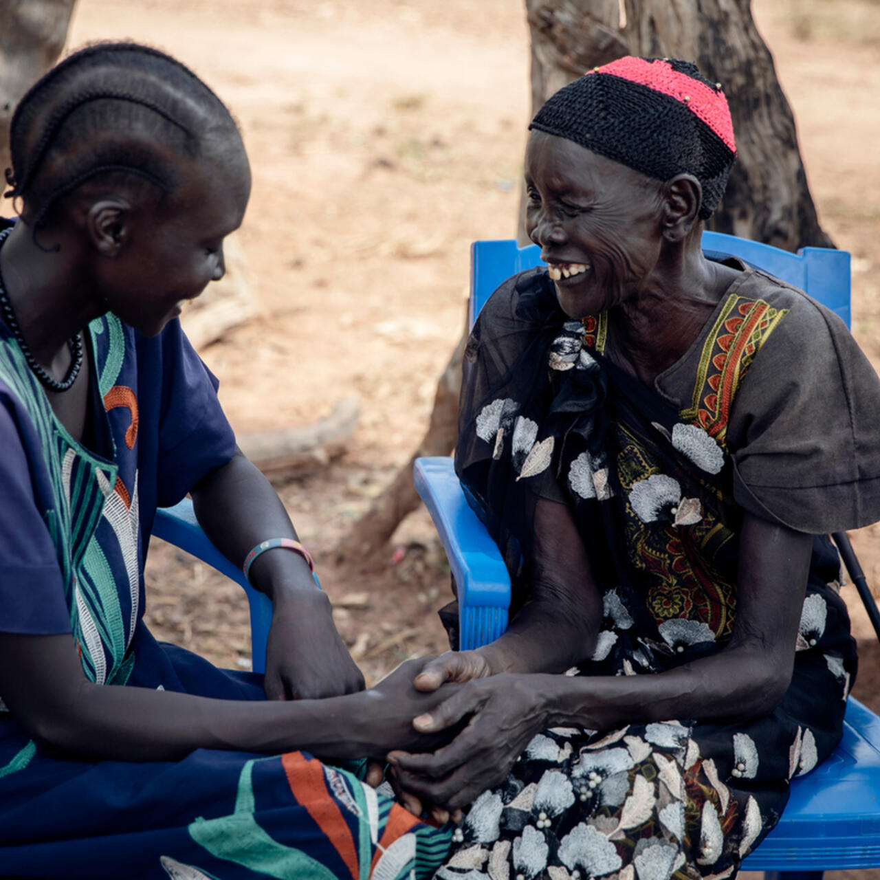 Veronica, 31, talks with her mother, Amou Makuei and support person, in Jamjang, South Sudan